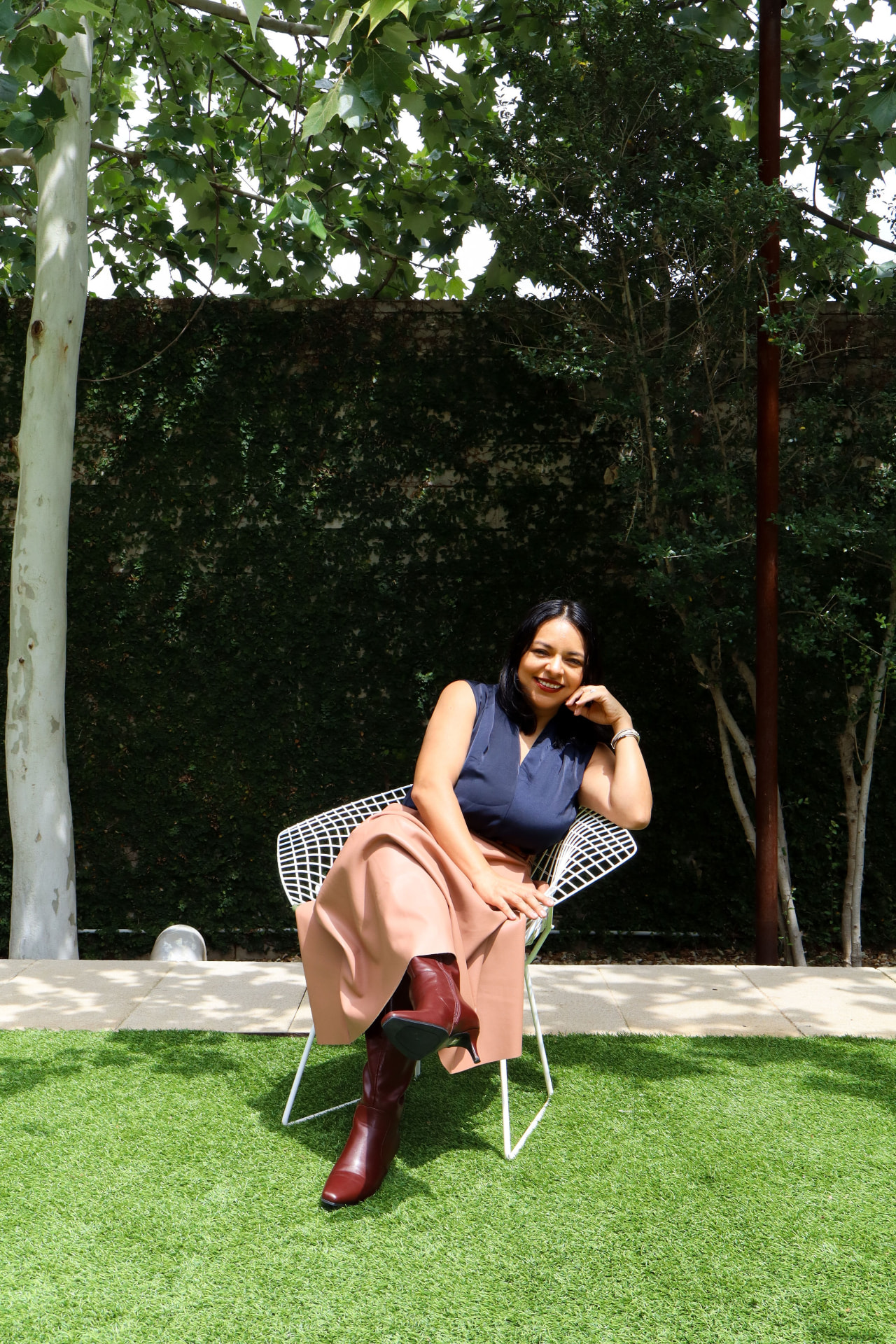 Nay Reyes seated outdoors in Austin
